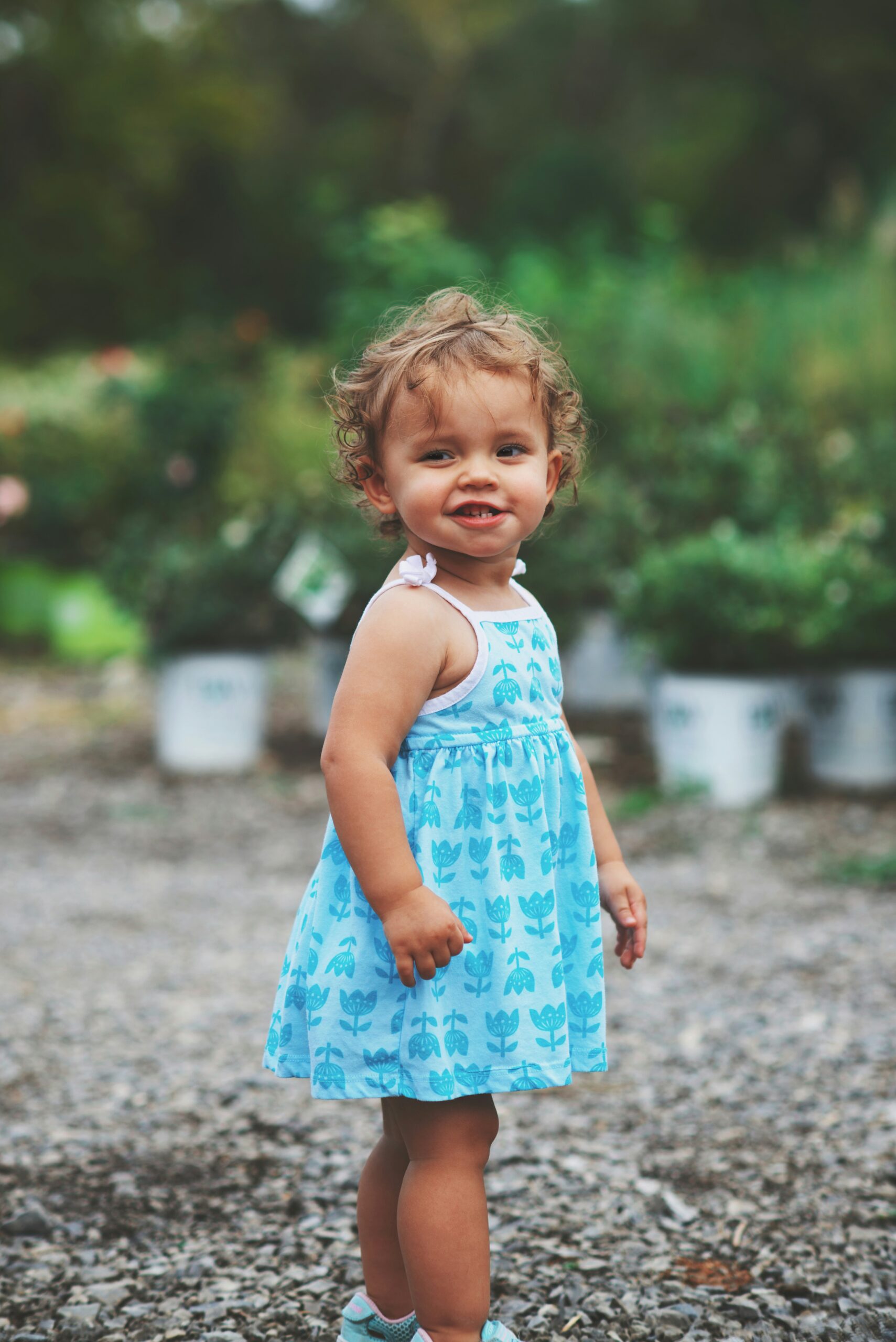 Toddler looking over her shoulder